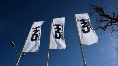 Flags with CNH Industrial logo are pictured outside CNH Industrial building in Turin