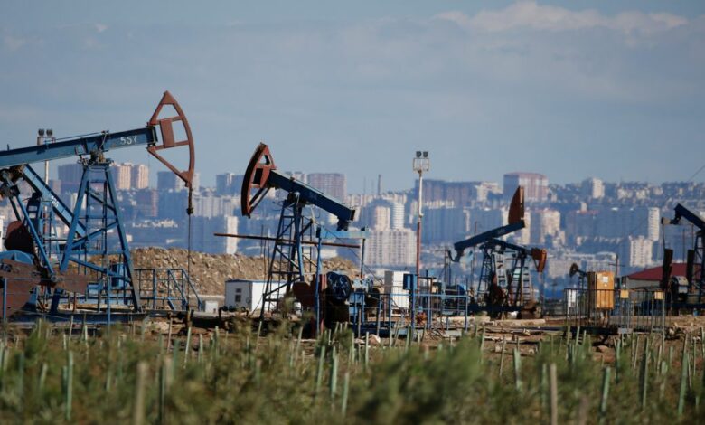 Pump jacks pump oil at an oil field on the shores of the Caspian Sea in Baku