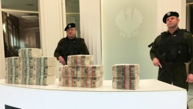 Security men at the Polish central bank headquarters guard piles of cash worth 1 million zlotys