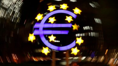 The euro sign is photographed in front of the former head quarter of the European Central Bank in Frankfurt