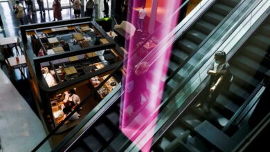 People are seen in a shopping mall on the first day of the opening of malls after a country lockdown, amid the coronavirus disease (COVID-19) pandemic, in Sintra