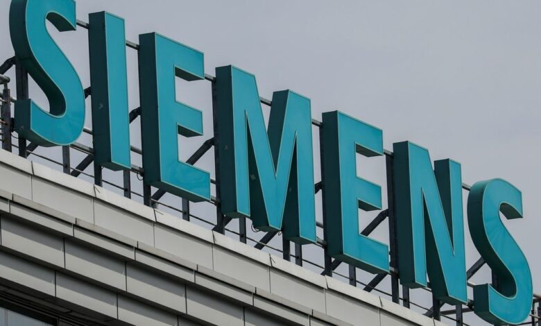 A sign with the logo of Siemens company is on display outside its office in Moscow