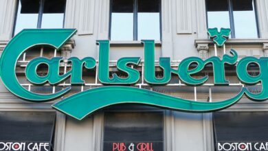 FILE PHOTO: A logo of Carlsberg beer is seen on the entrance of a pub in Brussels