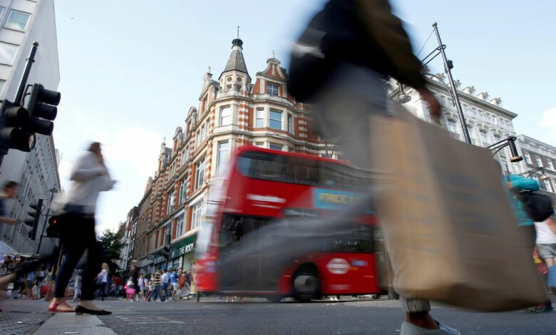 Shoppers crossing the road in Oxford Street, London