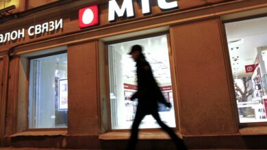 A man walks past a MTS shop in St.Petersburg