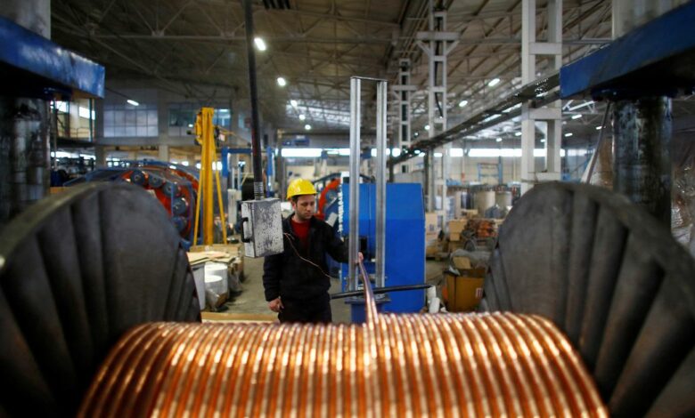 A worker checks copper cables being produced at a factory in the central Anatolian city of Kayseri