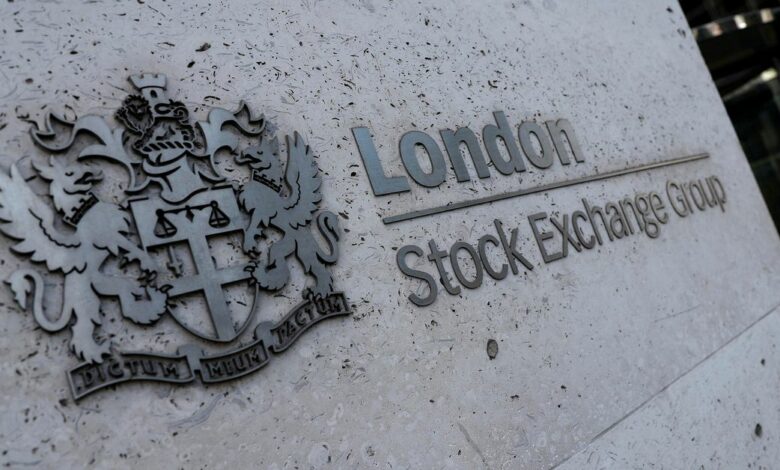 Signage is seen outside the entrance of the London Stock Exchange in London