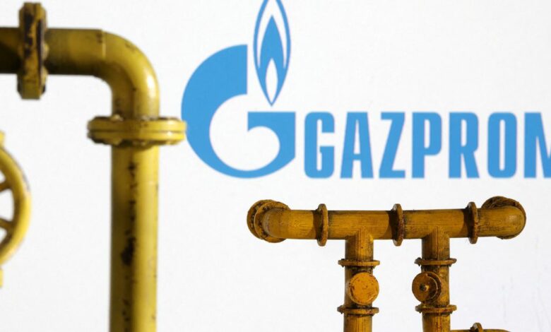 Illustration shows natural gas pipeline and Gazprom logo
