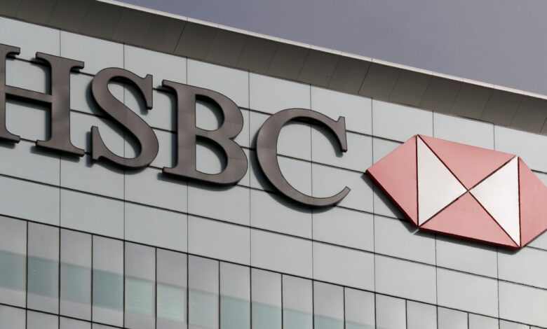 The HSBC logo is seen at their offices at Canary Wharf financial district in London