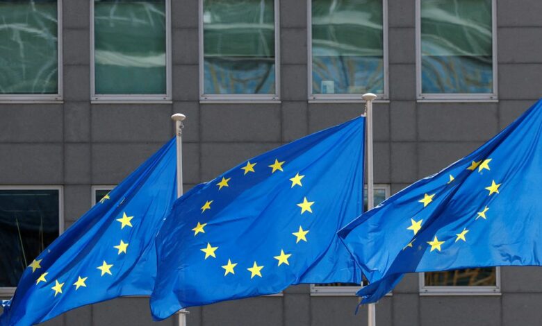 European Union flags flutter outside the EU Commission headquarters in Brussels