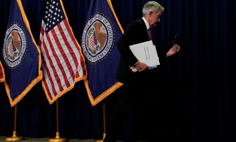 Federal Reserve Board Chair Jerome Powell leaves after a news conference, in Washington