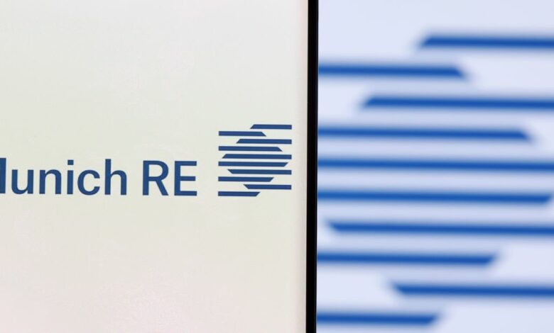 Illustration shows a smartphone with displayed Munich Re Group logo