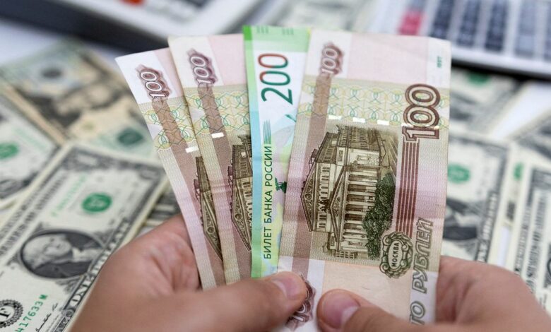 Illustration shows Russian Rouble and U.S. Dollar banknotes