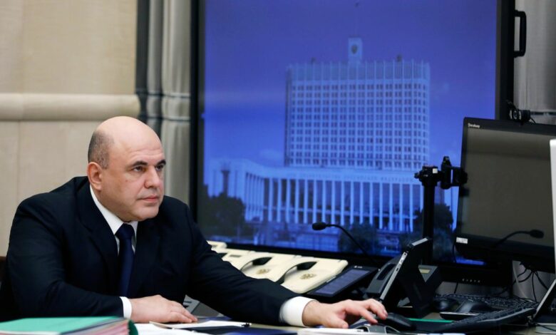 Russian Prime Minister Mikhail Mishustin chairs a meeting with members of the government via video link in Moscow
