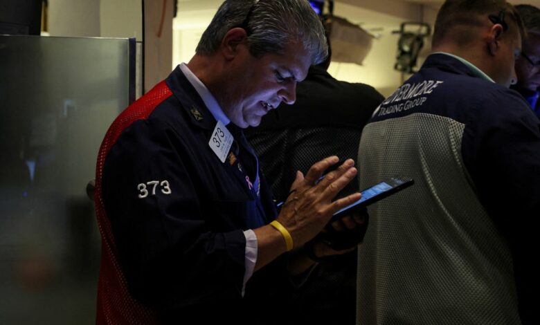 Traders work on the floor of the NYSE in New York