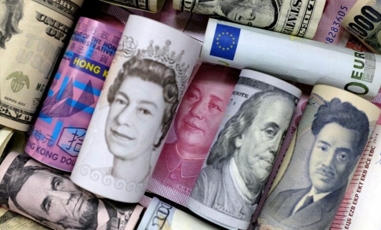 FILE PHOTO: Euro, Hong Kong dollar, U.S. dollar, Japanese yen, pound and Chinese 100 yuan banknotes are seen in this picture illustration