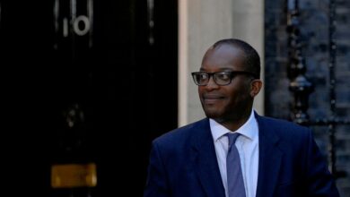 New British Chancellor of the Exchequer Kwasi Kwarteng walks outside Number 10 Downing Street in London