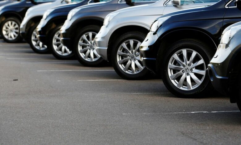 Cars are displayed outside a showroom in west London