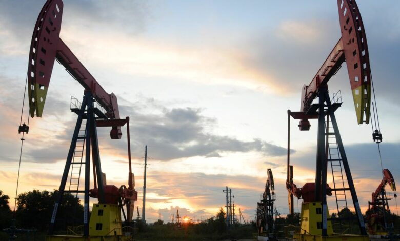 Pumpjacks are seen during sunset at the Daqing oil field in Heilongjiang