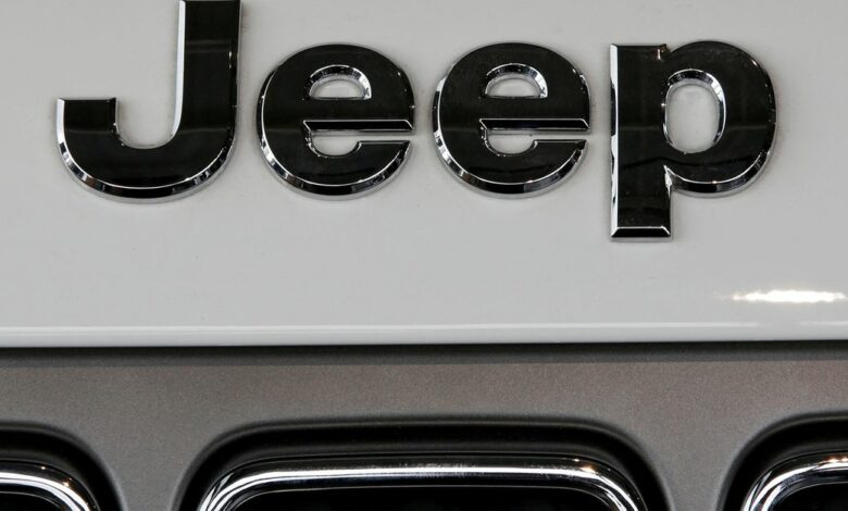 A Jeep logo is seen on a car at a showroom of a dealership in Merignac