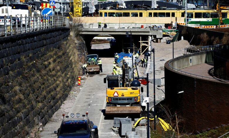 People work at a city infrastructure improvement site in Helsinki