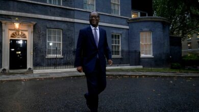 New British Health Chancellor of the Exchequer Kwasi Kwarteng walks outside Number 10 Downing Street in London