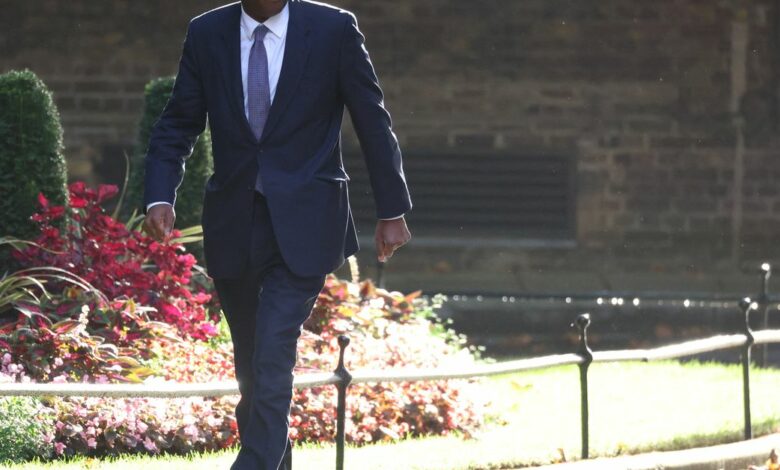 Chancellor of the Exchequer Kwasi Kwarteng walks outside Number 10 Downing Street in London
