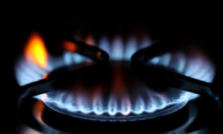 Flames come out of a domestic gas ring of an oven in Durham, Britain, September 23, 2021.