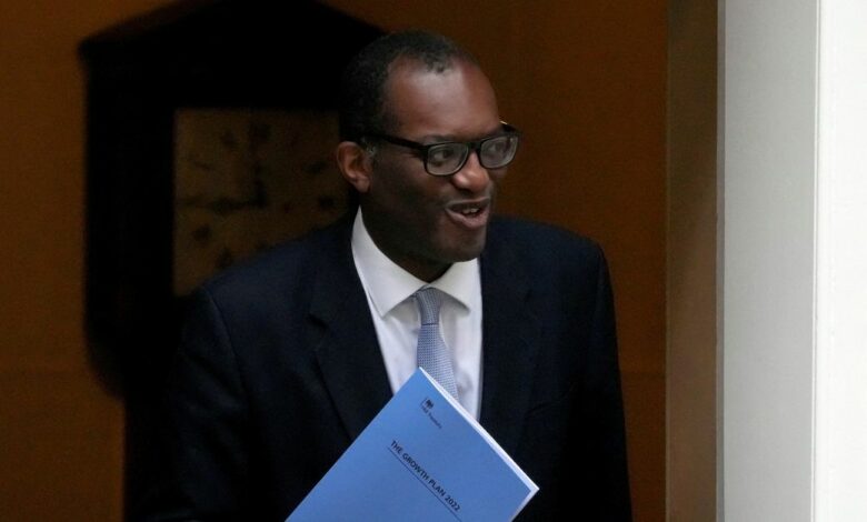 New British Health Chancellor of the Exchequer Kwasi Kwarteng steps outside Number 10 Downing Street in London