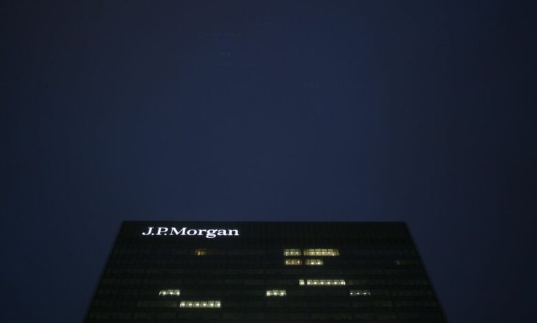 The J P Morgan buiding in Canary Wharf is seen in the early morning in London