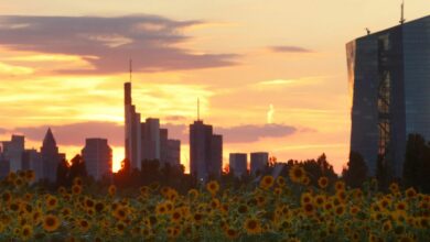 The sun sets behind the skyline of Frankfurt