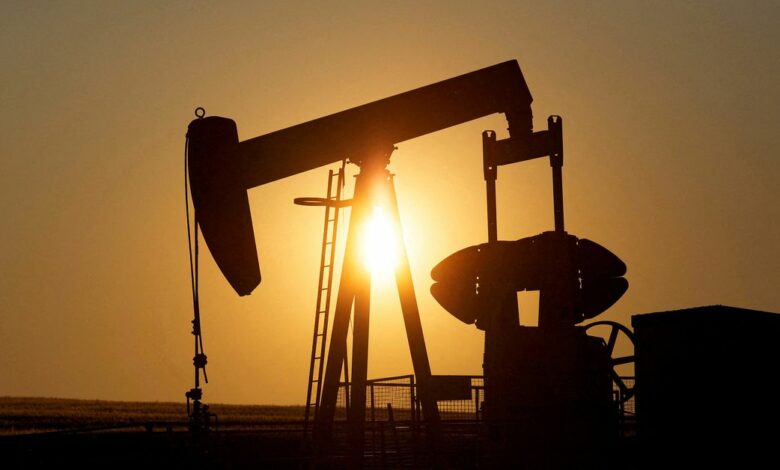 An oil pump jack pumps oil in a field near Calgary