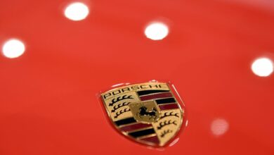 The logo of German carmaker Porsche AG is seen before the company