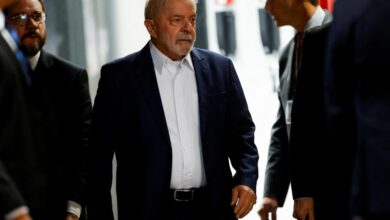 Brazilian President-elect Luiz Inacio Lula da Silva walks after attending a meeting at the transition government building in Brasilia