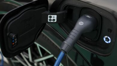 A Ford logo is seen on an electric vehicle charging cable during a press event at the Ford Halewood transmissions plant in Liverpool