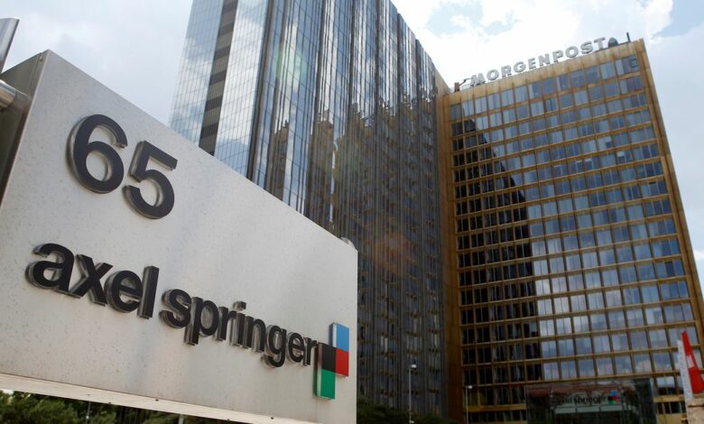 The logo of German publisher Axel Springer is pictured in front of the company