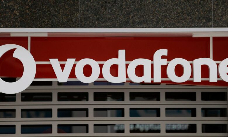 The logo of Vodafone is seen on the facade of a store in Ronda