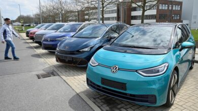Electric car models of the Volkswagen Group are parked outside the company